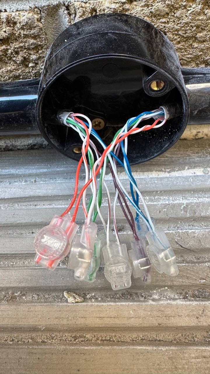 Outdoor data cable repair with protective conduit added to prevent further dog damage