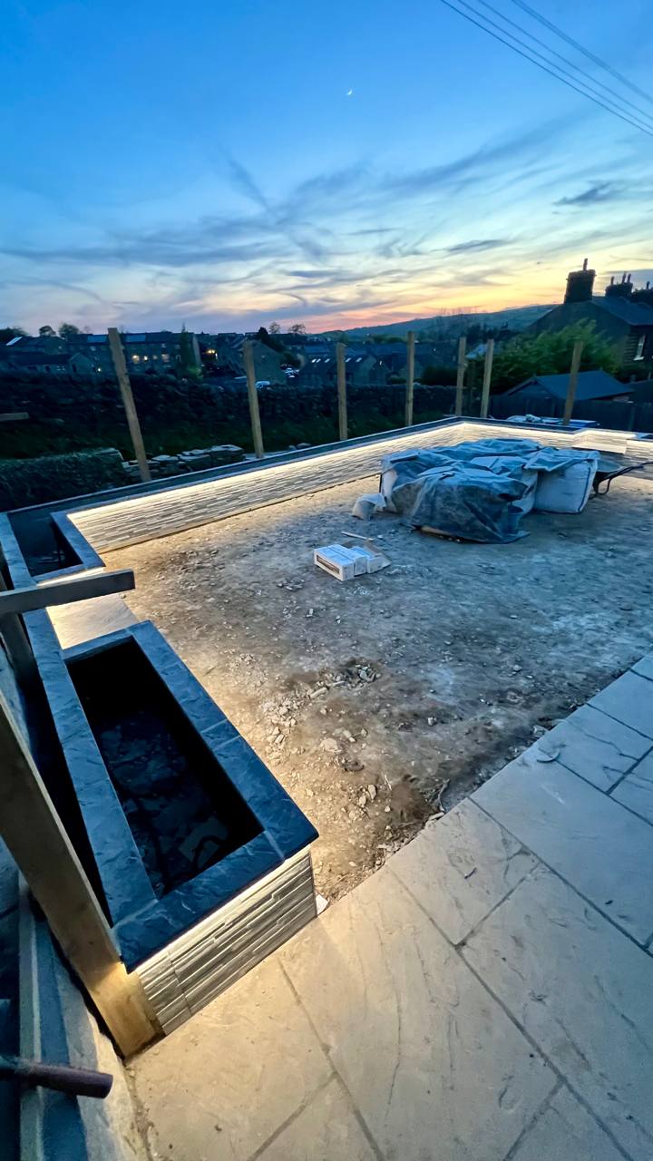 Finished patio and garden lighting installation at dusk